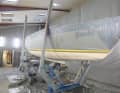 The residual moisture of the blasted laminate is measured and the body is dried if necessary