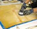 After the lid has been freed of foam residue and cleaned, the edges of the pilot opening and the cut-out are sanded at an angle from below