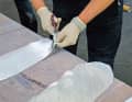 The number of layers depends on the thickness of the hull and the material used. We work with 600-gram layers, which add around 0.8 millimetres per layer, so 20 layers are required ...