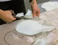 We work with 600 gram scrims and require ten layers. Their size is graded evenly, with alternating layers with +/-45 degree fibre orientation and those with 0/90 degree fibre orientation