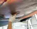 Epoxy resin thickened with microballoons is used as a levelling compound. The material is first applied generously to create an even layer thickness