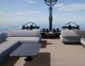 There are two helm stations on the flybridge, halyards and sheets run on four winches. Behind this is a lounge area. | Renderings: Advanced Yachts