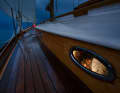 Sweet dreams. While a sailor steers the boat through the night, the free watch sleeps peacefully below deck