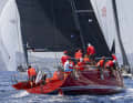 Hendrik Brandis' fiery red "Earlybird" sailed to World Championship gold off Porto Cervo.