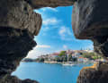 View through the walls of the Bourtzi fortress peninsula to the old town of Skiathos. If you're lucky, you might get a berth in the old harbour