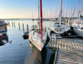 A space where there’s actually no one: the yacht with the red stripe is making use of a gap between the berth and the end of the jetty, left by the little red boat on the far left of the picture