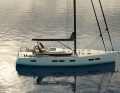 The cabin superstructure with the all-round window strip ends behind the mast. The foredeck remains unobstructed and sheer. The self-tacking jib is a possible option for the sails