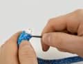 Bend the line strongly and push the sheathing braid to the side with an awl so that it opens. Patience is required