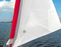 Galesail: The Doyle sail is equipped with a lighter cloth flap on the luff, which is placed around the rolled-up standard genoa and closed with carabiners. A derivative is called Coversail