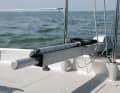 The tiller can be extended. Sitting on the coaming with outrigger, the boat is really fun