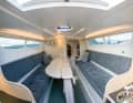 The saloon is divided by the centreboard box, the benches that can be converted into a bed offer plenty of space even for a large crew