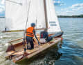 The already built wooden skiff on its maiden voyage