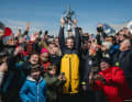 Happy with the winner's trophy: Charlie Dalin with the fans.