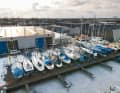 In rank and file: Boats on land in frosty conditions with standing rigging - common abroad