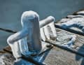 This bollard is covered with icicles of frozen precipitation. But mooring lines will soon find their place here again