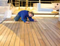 Times gone by: A Wolz Nautic employee checks the joints between the wide bars. The length of the planks suggests Burma teak