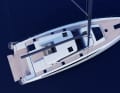 The steering position and external cockpit are protected by a fixed bimini with a windscreen in front of it