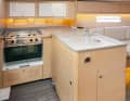 The galley has plenty of storage space and two pull-out waste bins amidships