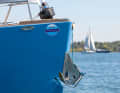 Only the Bruce anchor fits into the recess in the stern. So it doesn't get in the way on deck