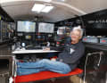 Adventurer and boat-building pioneer Sedlacek in the command centre of his Imoca