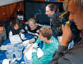 The changing crews include students, scientists and journalists