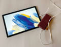 A power bank charges the tablet easily