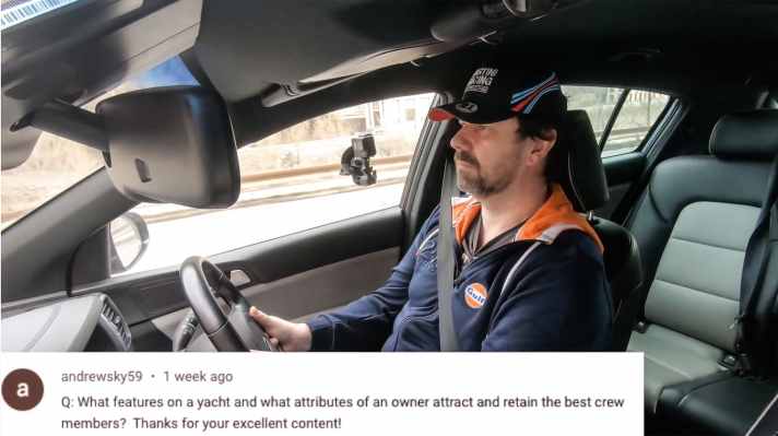 He answers questions from the audience, sometimes at the wheel of his Porsche