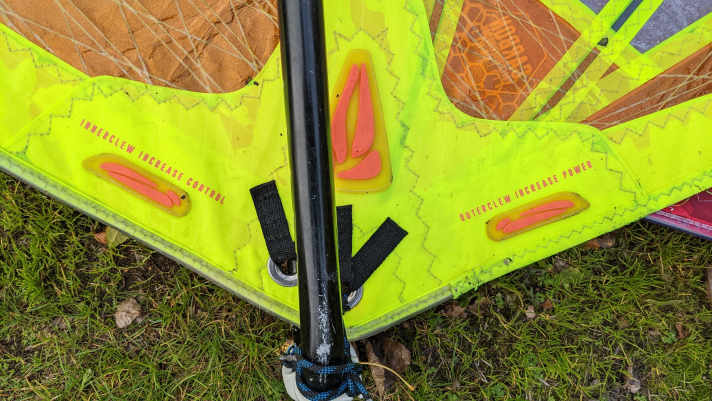 The lower, inner eyelet (left in the picture) improves control, while the upper, outer eyelet is designed to give the sail more power.