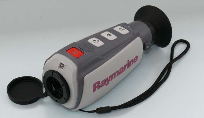   Buttons for switching on, display mode, image brightness and digital zoom, with the USB charging socket in between