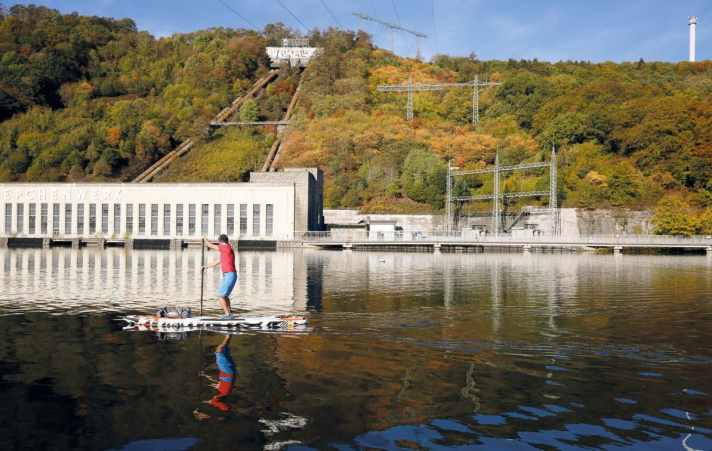 Charming contrast between nature and industry in Indian summer at Lake Hengstey.