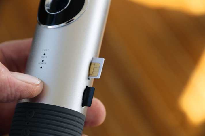 The camera has two slots: one for the SIM card and another for the memory card