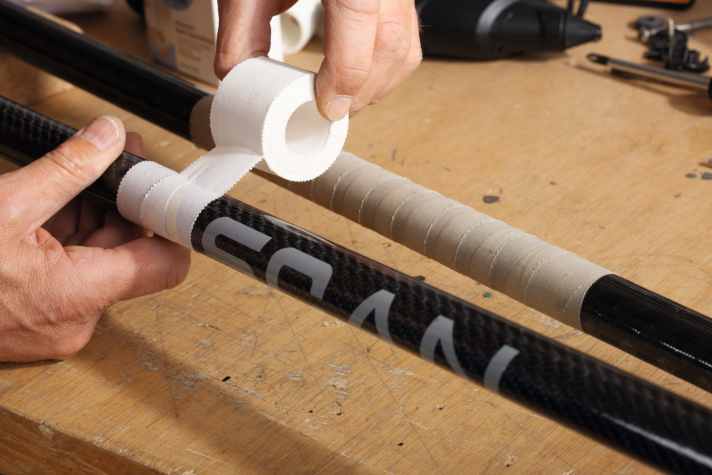 "Leukotape" and similar tapes from the drugstore also stick well; when wet, some adhesive always comes through, so the adhesion is really great - but quite rough and not necessarily suitable for softened office hands. Even after a year of use, our tape was yellowed but still on. Wave surfers know the trick.