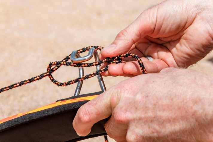 ...you can now push through a trimming aid, e.g. the trapeze hook or a screwdriver...