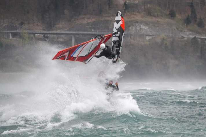 Who is that waving from the spray?