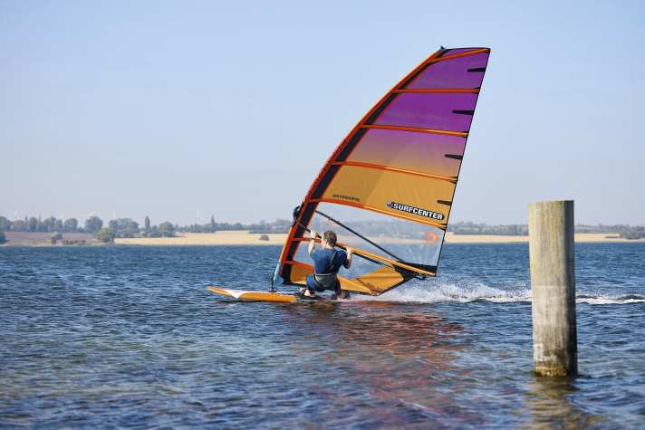 High boom, long harness lines, that brings control and early planing.