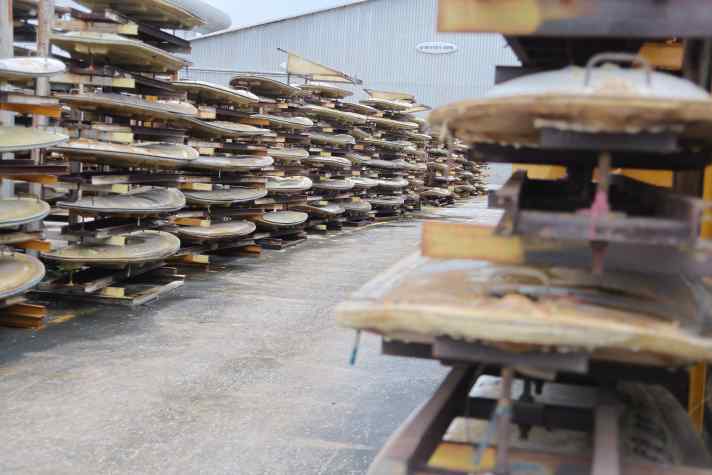 The core moulds are stored in long rows on the factory premises