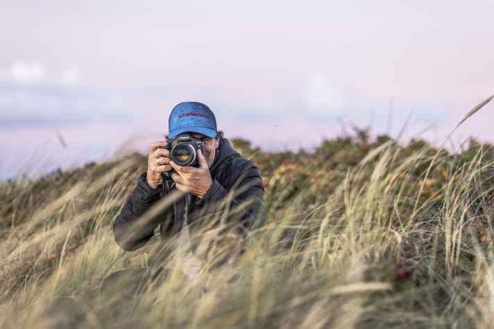John likes to change his point of view more often at the spot, sometimes taking low positions with "foreground".