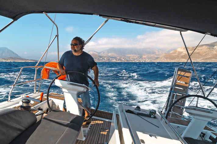 With the Meltemi behind it, the charter yacht flies through the area