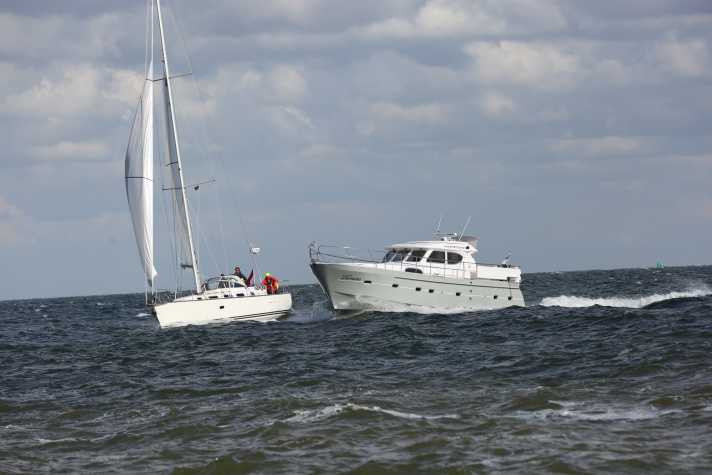 The two boats: a C-12.50i sailing yacht and an Elling E4 motorboat