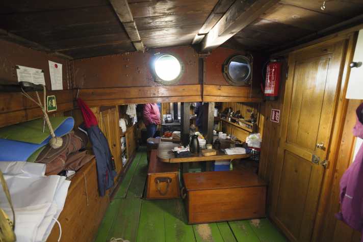 View from aft into the former cargo hold, where you sit on sea chests