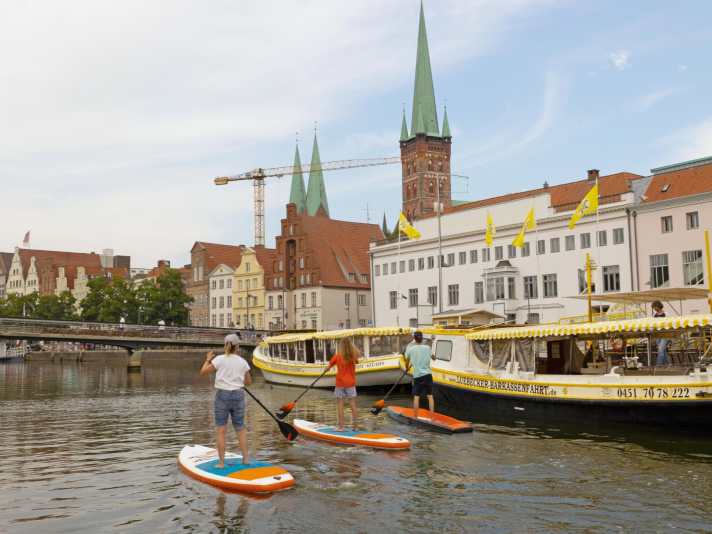 The old town centre is perhaps the most entertaining part of the SUP tour in summer when there are lots of people outside.