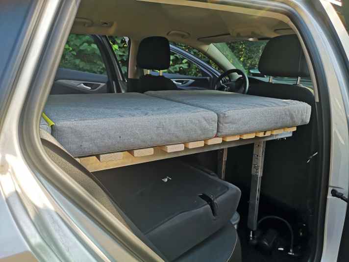 Storage space remains under the bed for the material