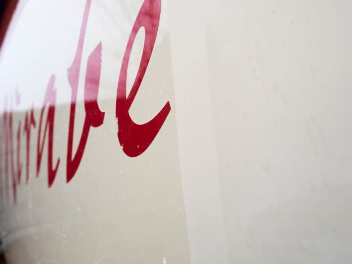 Polished and sealed, the 40-year-old gelcoat looks almost like it has been painted over. The original condition before polishing can still be seen on the right