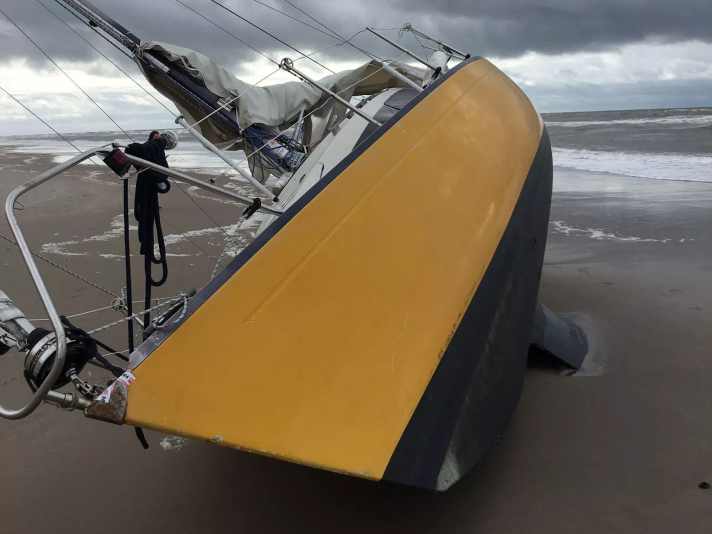 Stranded sailing yacht on the Danish coast
