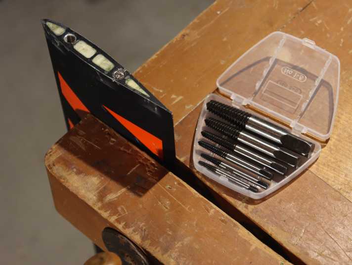 Fix the film mast in the vice, you won't need the screw extractors until later...