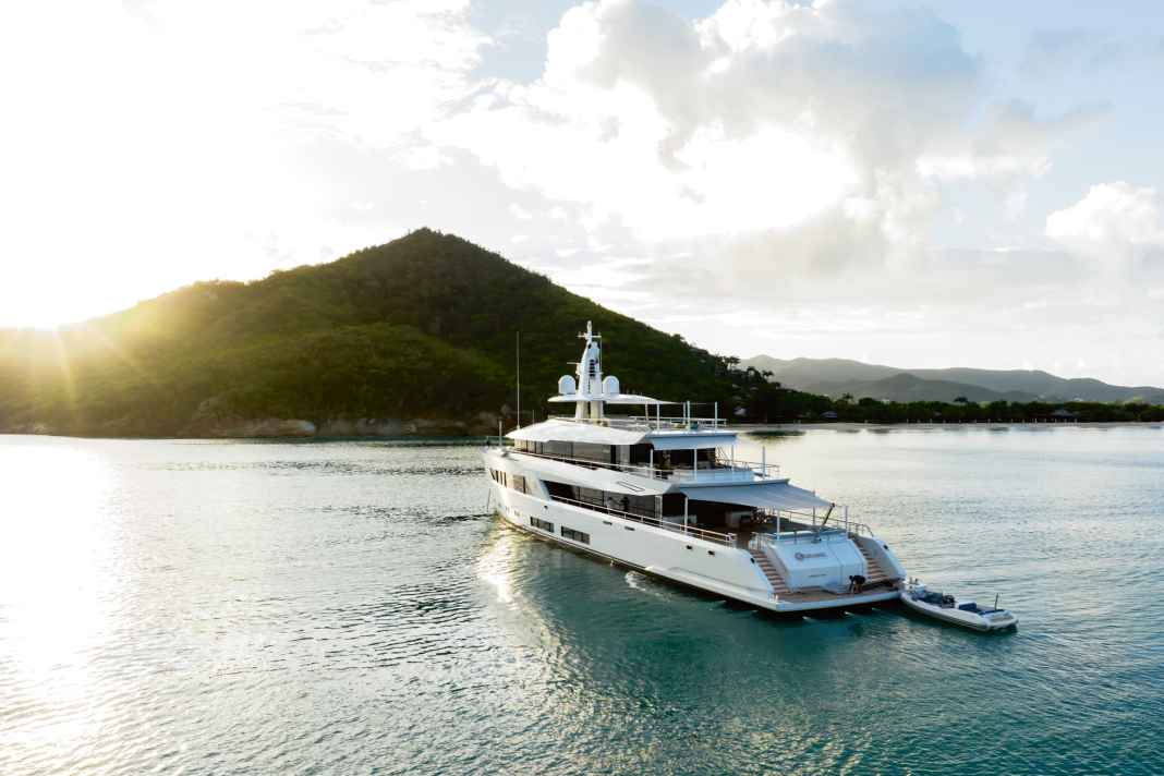 At anchor: "Moon Sand" has spacious decks that are simply shaded by awnings. The tender selection is small but fine.