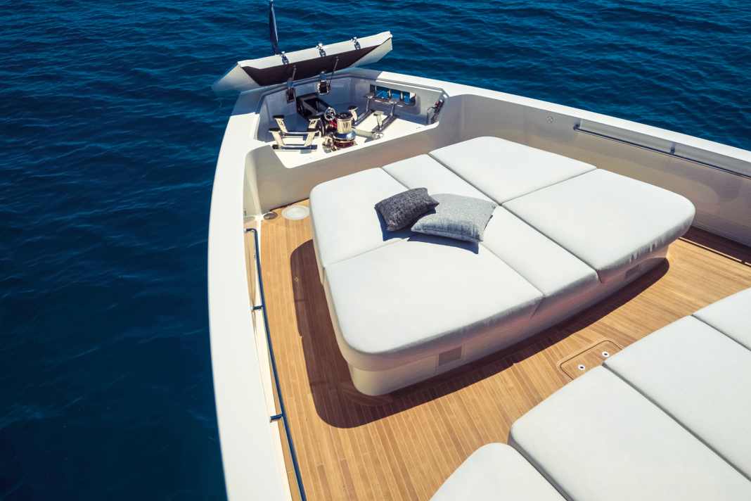 The sun lounger at the bow is surrounded by sea air, the cleats and anchor winch are concealed