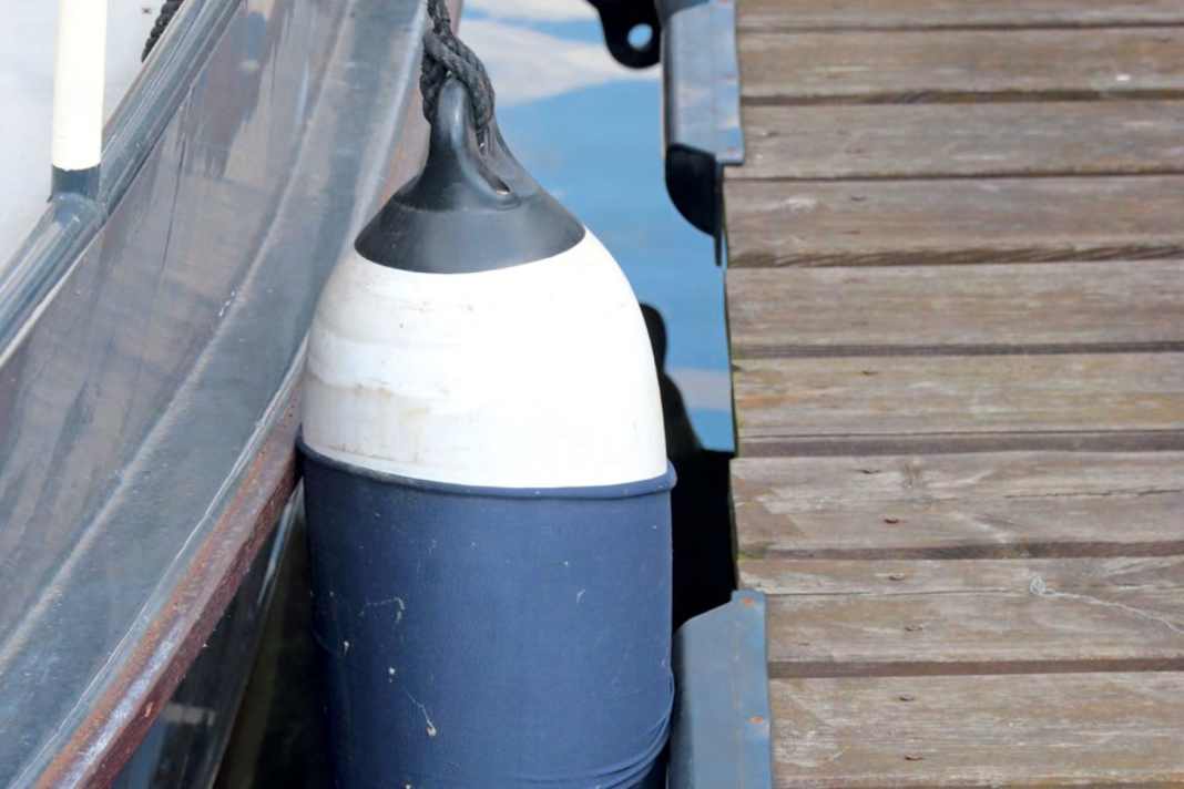 1] Long fender on a ship's side