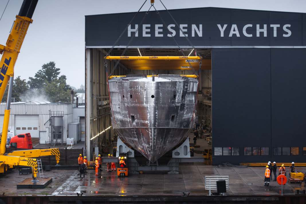 The aluminium body slowly rolls out of the hall.