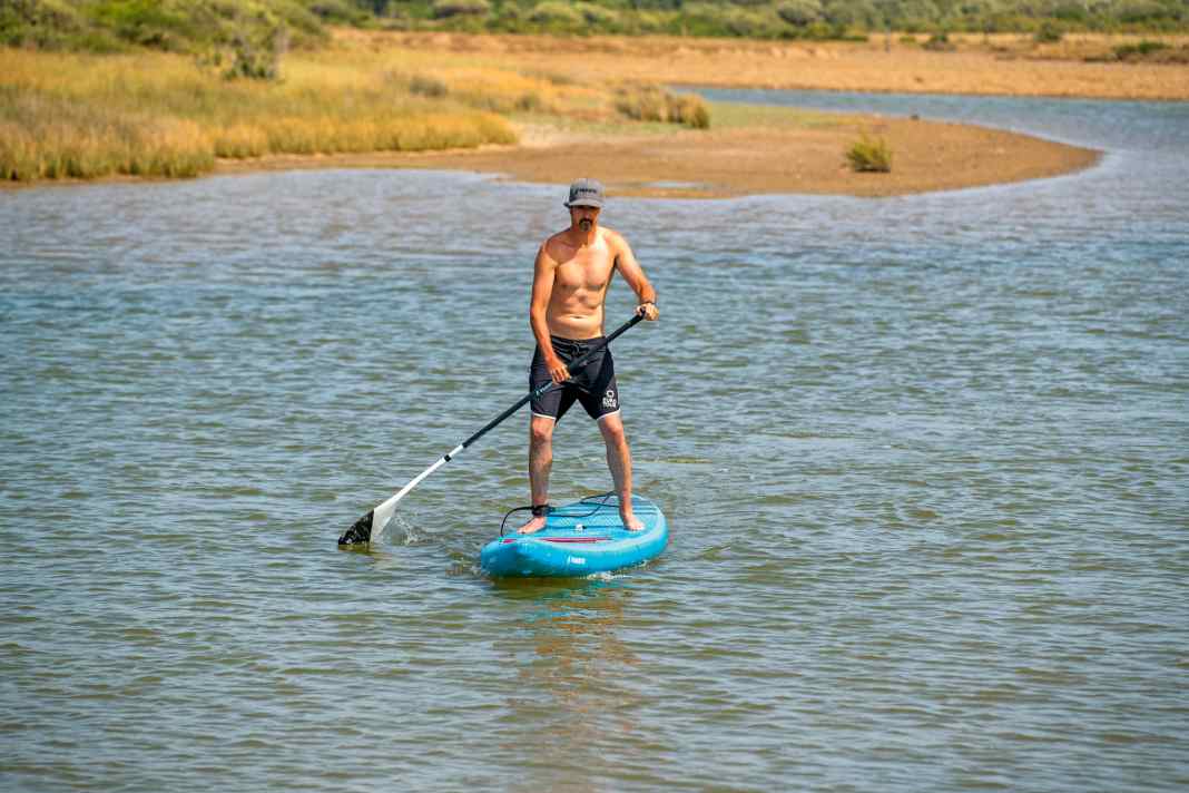 For example, if you are paddling on the right-hand side, you bring the paddle down while maintaining the same hand position...